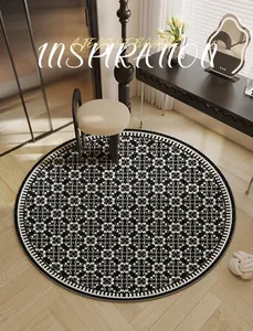 High-quality detail of a round black and white patterned velvet rug in a chic bedroom
