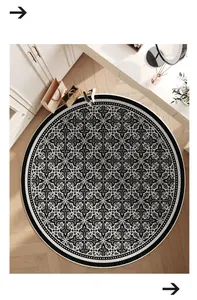 High-angle view of a round Belgian velvet rug with an intricate black damask pattern