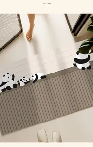 Quick-drying diatomaceous earth bath mat with cute panda patterns at bathroom door