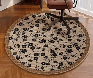 Detail view of vintage floral round chair mat on wooden floor under office chair