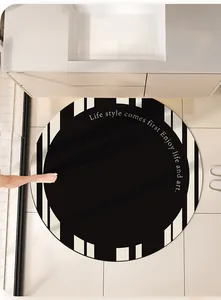 Modern black and white round absorbent leather bathroom mat shown in a bathroom scene