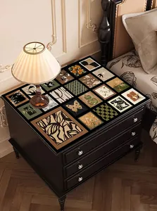 Close-up of French vintage waterproof leather table mat with patterns on a nightstand.