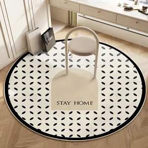 Tappeto rotondo per vanità con motivo geometrico nero e scritte Stay Home