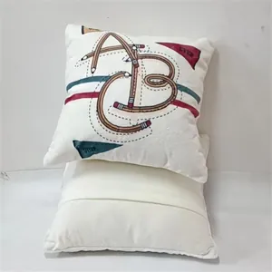 Close-up of white cushion cover featuring a creative pencil-style ABC alphabet print