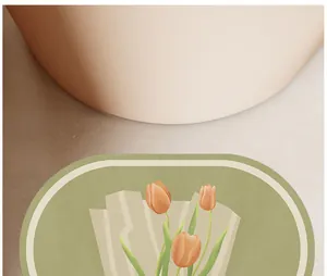 Détail de près du tapis de bain en terre de diatomée douce avec motif tulipe orange