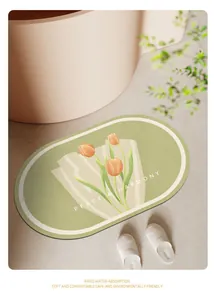 Détail d'un tapis de bain tulipe ovale doté d'une fonction d'absorption d'eau rapide.