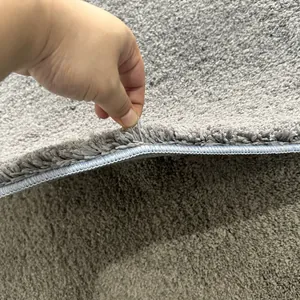 Detailed close-up of grey thick shag cake velvet bath mat showing soft texture and thickness.