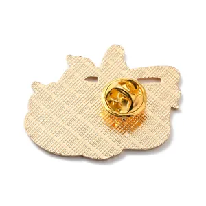 Close-up view of gold enamel pin back with textured finish and secure butterfly clutch.