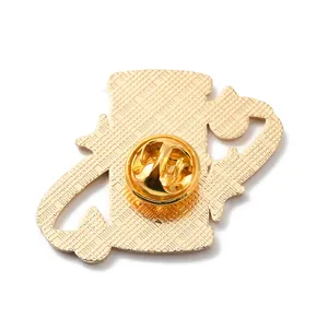 Close-up back view of a golden enamel pin with high-quality butterfly clutch and textured finish