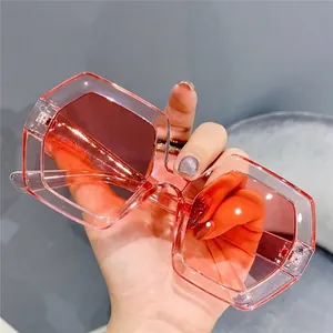 Oversized retro polygonal sunglasses with gradient lenses and transparent pink frames