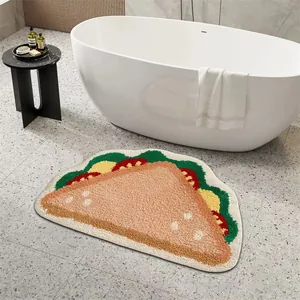 Vista dettagliata del tappeto da bagno floccato a forma di sandwich su terrazzo