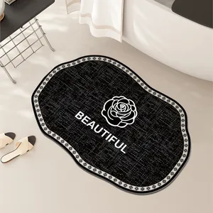 Élégant tapis de bain noir antidérapant avec motif de camélia et texte Beautiful design