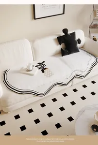 Modern cream-colored irregular sofa cover with minimalist plant print and black trim