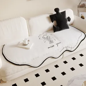 Minimalist cream irregular Dornier sofa mat with tulip floral print and poetic text design.