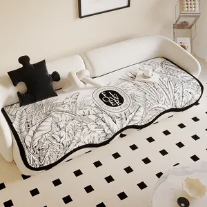 Irregular shaped cream sofa cushion featuring botanical leaf prints and non-slip silicone bottom