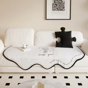 Irregular cream Dornier sofa cushion cover with minimalist floral print and wave edges