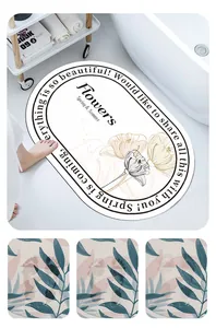 Absorbent oval diatom mud bath mat with elegant floral design and non-slip bottom