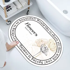 Close-up of a soft diatom mud absorbent bath mat featuring elegant floral line art and quotes