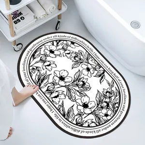 Oval absorbent diatom mud bath mat with minimalist black and white floral illustration