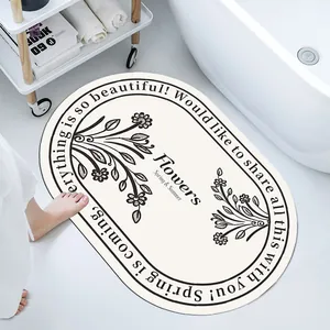 Soft diatom mud absorbent bath mat with floral design and motivational text