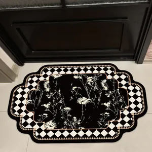 Vintage style bathroom mat with black and white checkerboard and floral pattern