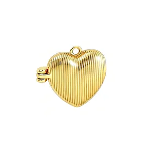 Detail view of a gold-plated heart locket featuring a vertical striped texture.