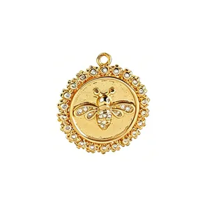 Detailed macro view of a gold-plated bee pendant with sparkling cubic zirconia inlay