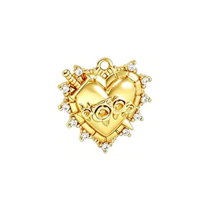 Macro view of a gold-plated heart pendant with zircon accents and rose filigree details.