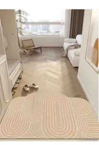 Paillasson géométrique crème en PVC placé dans une entrée moderne et lumineuse de luxe