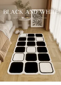 Moderno tappeto da comodino in peluche a scacchi bianco e nero in una camera da letto
