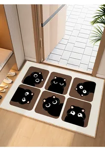 Close-up of a cream entryway mat featuring cute black cat expressions in brown squares