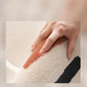 Soft Belgian velvet entrance mat with non-slip backing and minimalist cream pattern