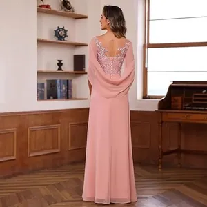 Elegant back view detail of a dusty pink chiffon evening gown with lace appliqué and cape sleeves