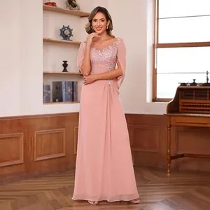 Detailed view of dusty rose chiffon evening gown with lace bodice and cape sleeves