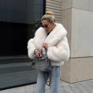 Manteau élégant en fausse fourrure blanche à grand revers pour femme mode hiver