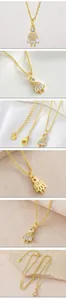 Close-up of elegant gold-plated girl pendant necklace featuring sparkling cubic zirconia