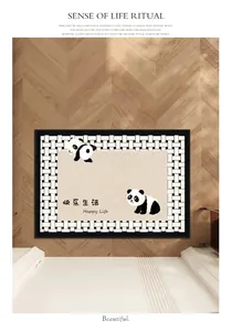 Close-up of Belgian velvet entrance mat with panda design and Happy Life text