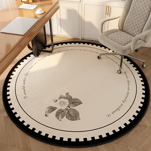 Vintage round beige rug with camellia flower and elegant black border for home office