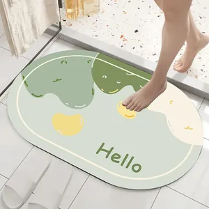 Close-up of absorbent diatom mud bath mat with Hello greeting in modern bathroom