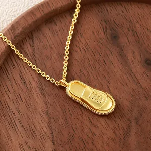 Gold-plated sneaker pendant necklace with sparkling zircon accents for men