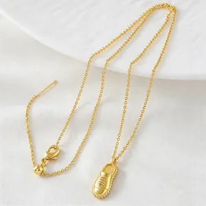 Gold-plated copper necklace featuring a stylish sneaker pendant with zircon accents.