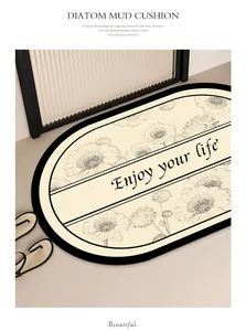 Tappetino da bagno assorbente in terra di diatomee con motivi floreali e frase motivante.