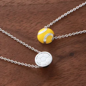 Sporty soccer and softball pendant necklaces for friends on a rustic wooden background