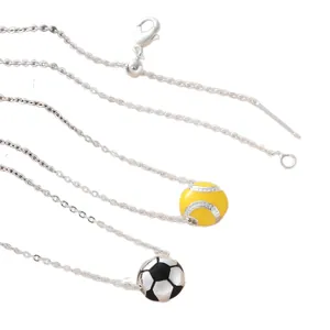 Sports themed necklaces with miniature soccer and softball pendants on silver chains.