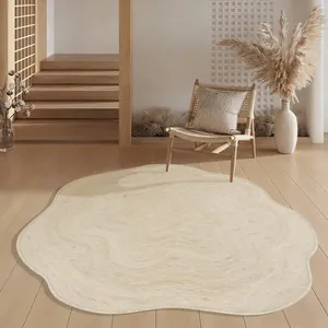 Irregular cream-colored minimalist rug in a modern Japanese-style warm living room
