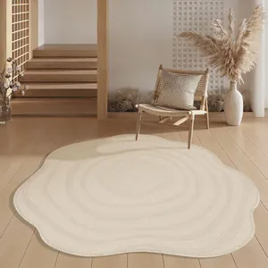 Close-up detail of cream irregular shaped area rug in minimalist bedroom interior decor