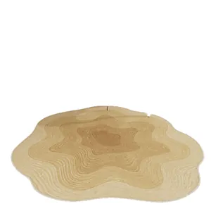 Cream-style irregular shaped rug with wavy concentric patterns for bedroom or dressing room
