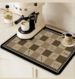 Brown checkered PVC absorbent mat placed under a retro coffee machine on a kitchen counter