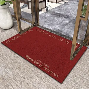 Close-up detail of red silk loop entrance door mat featuring inspirational English quotes