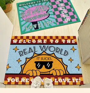 Detail showing American style non-slip silk loop door mats with retro 'Real World' slogans